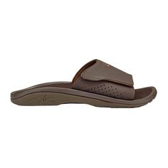 OluKai Nalu Sandal Slides for Men Product Overview: The OluKai Nalu Slide Sandals for Men takes all the comfort and offers a slide version featuring water-resistant faux leather and an adjustable strap for a superior fit for your foot. If you love the features of the Ohana, then you will not be disappointed with the Nalu Slide! Product Features: Semi-rigid orthotic arch support Slide sandal design Water-resistant synthetic strap with an ultra soft, quick-drying jersey knit lining High-quality mi Brown Slide Flip Flops With Cushioned Footbed, Brown Synthetic Slide Sport Sandals, Leather Slide Flip Flops For Outdoor, Comfortable Brown Slide Sport Sandals, Comfortable Brown Sport Slide Sandals, Brown Synthetic Slide Sandals, Brown Slides With Arch Support For Outdoor, Brown Outdoor Slides With Arch Support, Adjustable Brown Slides With Removable Insole