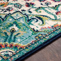 an area rug with various colors and designs on it