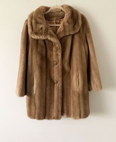 "Description: Vintage 80s Tissavel of France faux fur light brown coat with beautiful buttons. Condition:  Very good. (Please see all pics) Measurements: Approx. Length: 32\" HPS, Chest (Flat across underarm): 23\", Sleeve length (from HPS): 26\" ALL SALES FINAL - Please check and compare measurements to something you own before purchasing. Most of my products are vintage/used, so please check pictures and feel free to ask questions. Thank you." Vintage Winter Fur Coat With Faux Fur Lining, Vintage Faux Fur Long Sleeve Outerwear, Vintage Faux Fur Coat, Vintage Mink Fur Coat, Penny Lane Coat, Brown Vintage Fur Coat With Faux Fur Trim, Sherpa Lined Denim Jacket, Winter Fur Coats, Vintage Brown Faux Fur Outerwear