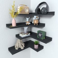 there are three shelves with various items on top of each shelf, and one has headphones