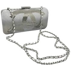 A piece as rarely seen. Chanel has outdone herself in this silver and white minaudiere. On the one hand, a large silver CC shiny on the top then subtly rounded white on the bottom and the bottom is rounded white on the top and silver on the bottom in a gradient. A real artistic work which makes it a collector's item. The back is domed in white on the top in gradient also and silver on the bottom. the interior of this evening bag is impeccable ivory satin. The shiny silver clasp signed CHANEL clo African American Braided Hairstyles, Jaguar Type, Silver Pants, Chanel Clutch, Chanel Suit, Chanel Runway, Chanel Box, Chanel Vintage, Vintage Chanel