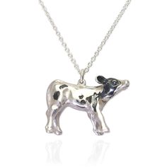 A baby cow pendant handmade in our UK studio, complete with bendy little legs, taking those first few tentative steps, a trusting, sweet wide-eyed face, and distinctive patch markings, made using oxidised silver. All our jewellery is cast in 100% recycled sterling silver or gold. Cows are intelligent animals, who remember things and form complex relationships with others. In the wild, cows can live for 20 -30 years, but on dairy farms, straight after birth male calves are either shot or trucked Ffa Jewelry, Male Calves, Western Keychains, Cow Pendant, Cow Jewelry, Cow Necklace, Female Cow, Preppy Birthday, Cat Necklace Silver