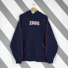 Vintage Nike Gonzaga Bulldogs Ncaa Hoodie Sweatshirt Large Gonzaga Zags Embroidered Pullover Nike Gonzaga University Hoodie Sweater Size L Good Used Condition. Have minor stains (REFER PICTURE). *Color may be slightly different from the original color due to lightning and background. Size (On Tag) : Size L *To make sure if it FITS YOU, refer at the exact measurements. Size Measurement (All measurements were taken lying flat) : Width [armpit to armpit] : 26 inches / 66 cm Length [shoulder to end of garment] : 28.5 inches / 72 cm Ship by Using Express Shipping, takes 3-5 business days to arrived. *Please leave your phone number on the note when purchased. REF : r11012024 - M281 Pull Nike, Embroidered Pullover, Gonzaga University, University Hoodie, Gonzaga Bulldogs, Nike Vintage, Vintage Nike, Hoodie Sweater, Hoodie Sweatshirt