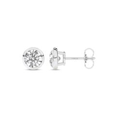 Immerse yourself in the understated beauty of our Round Solitaire Bezel Diamond Studs. Crafted with precision, each earring features a mesmerizing round diamond cradled in a sleek bezel setting. The minimalist design accentuates the lab-grown diamond's brilliance, making these diamond stud earrings a timeless addition to any jewelry collection. Minimalist Round Diamond Earrings For Formal Occasions, Elegant White Gold Diamond Earrings With Tension Setting, Elegant White Gold Earrings With Tension Setting, Elegant Diamond Earrings With Tension Setting, Diamond White Bezel Set Earrings For Formal Occasions, Vvs Clarity Diamond Earrings, White Gold Round Cut Earrings With Vvs Clarity, Vvs Clarity Round Cut White Gold Earrings, Diamond White Earrings With Bezel Setting For Formal Occasions