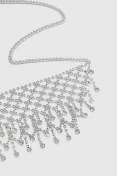 This sumptuous piece of jewelry features a retro-elegant yet slightly modern style that complements the lavish garments, reminiscent of the roaring 1920s. Features: High quality rhinestones Multi layer sparkling rhinestone tassels Height: 2.36 inch / 6 cm Length: 20 inch / 50.8 cm (extension chain included) Glamorous Diamond Rhinestone Necklace For Formal Occasions, Glamorous Diamond Rhinestone Necklace For Formal Events, Silver Necklace With Rhinestone Fringe For Party, Glamorous Diamond Necklaces With Rhinestones, Dazzling Rhinestone Necklace For Party, Glamorous Diamond Necklace With Rhinestones, Silver Rhinestone Fringe Necklace For Party, Glamorous Diamond Rhinestone Necklace, Party Rhinestone Necklace With Bling