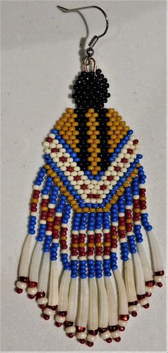 a pair of beaded earrings hanging from hooks