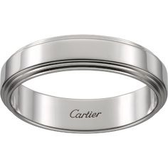 a white gold wedding band with the word carrier engraved on it