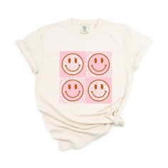 Looking for a cute versatile top to wear this summer? Make sure to grab one of our Pink Four Square Smiley Faces garment dyed graphic tees! This soft and comfortable graphic tee is the perfect top for any outfit. It can be paired with biker shorts, jeans, or even a simple skirt/dress! This tee is true-to-size, so be sure to order your regular t-shirt size! If you are looking for a more oversized look, make sure to size up! Trendy Cream Summer T-shirt, Trendy Bleached T-shirt With Relaxed Fit, Acid Wash T-shirt For Everyday Spring Wear, Spring Bleached Relaxed Fit T-shirt, Everyday Acid Wash T-shirt For Spring, Bleached Relaxed Fit T-shirt For Spring, Relaxed Fit Bleached T-shirt For Spring, Cute Tie Dye Graphic Print T-shirt, Cute Tie Dye Graphic T-shirt