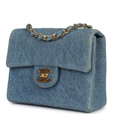 This Vintage Chanel Mini Square Flap Bag is in blue denim with gold hardware, front flap with CC turnlock closure, and an interwoven gold tone chain link with red leather shoulder/crossbody strap.The interior is lined in red leather and features a zipper pocket with Chanel pull and an open pocket below.Collection: 1-series (1989-1991)Origin: FranceCondition: Vintage; Excellent - This bag retains its shape. There's no plastic on the hardware. There's minor scratching to the hardware. The exterior leather has signs of wear with fading to the denim around the corners and around the flap. There's a minor crease on the bottom base of bag. The interior leather shows signs of wear with some minor scuffing. The date stamp sticker is still intact.Accompanied by: Chanel dustbag and COA cardMeasureme Chanel Mini Square, Chanel Mini, Celine Bags, Vintage Chanel, High Jewelry, Flap Bag, Blue Bags, New Bag, Vintage Denim