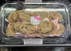 hello kitty cookies and chocolate chip cookies are on display in a case at a store