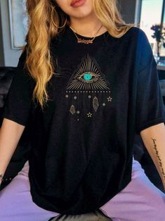 All Seeing Eye Spiritual Shirt Aesthetic Shirt Tarot Shirt Third Eye Good Vibes Shirt Witchy Clothing Oversized Tshirt Third Eye Tarot Shirt F A C T S  about our shirts: ✺ Super soft and comfy ✺ Design is in a high quality organic ink print ✺ Care Instructions: Machine wash cold inside out with mild detergent and like colors for best results. Tumble dry on a low cycle or hang dry for best results S I Z I N G  Guide: ✺ Adult Sizing is unisex so runs a touch loose. ✺ kids, toddler and infant sizin Oversized Black Top With Front Print, Oversized Grunge Top With Front Print, Eye Spiritual, Tarot Shirt, Witchy Clothing, Spiritual Shirt, Good Vibes Shirt, Cottagecore Clothes, Spiritual Shirts