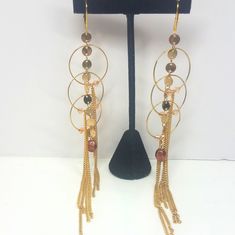 Beautiful Gold Dangle Drop Chain Earrings. Feature Light Brown/ Reddish Bead With Circular Chains Connecting. Brand New. 6.25" Long Gold Dangle Earrings With Beaded Chain, Adjustable Chain Party Earrings, Gold Linear Earrings With Dangling Beads For Party, Metal Drop Earrings With Beaded Chain, Elegant Gold Beaded Chain Chandelier Earrings, Elegant Gold Chandelier Earrings With Beaded Chain, Adjustable Beaded Chain Earrings For Party, Metal Beaded Chain Dangle Earrings, Adjustable Gold Earrings With Beaded Chain