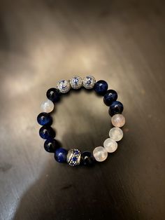 Zeta Phi Beta Soriety Charm Bracelet! Made With Blue Tiger Eye Gemstones To Aid In Serves As A Stone of Protection and Strength, Aid In Overall Bodily Healing, and it Promotes both Physical and Mental Development! Blue Tiger Eye Bracelet, Mental Development, Blue Tiger Eye, Blue Tiger, Zeta Phi Beta, Tiger Eye Bracelet, Blue Tigers Eye, Tigers Eye Gemstone, Charm Bracelets