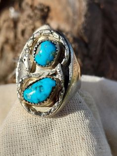 Silver Snake Turquoise Ring - Native American Made Jewelry - Mans Ring - Turquoise Ring - Hand Crafted Mans Ring This size 13 turquoise ring is created uniquely, with two turquoise nuggets casted with a snake wrapped around them in a figure eight.  Not another one like it.  Pure silver ring with two turquoise nuggets casted and circled with a silver snake.  Meaning eternal love - engagement ring for men. 1970's Native American Jewelry - Southwestern - Nature - Handmade - Handcrafted Measures: Size 13 - 1 1/4" ring height x 7/36" band height Vintage Turquoise Ring For Wedding, Turquoise Ring With Patina For Anniversary, Artisan Turquoise Collectible Rings, Vintage Turquoise Promise Ring, Turquoise Vintage Promise Ring, Anniversary Turquoise Ring With Patina, Adjustable Turquoise Open Ring For Wedding, Unique Turquoise Open Ring For Anniversary, Blue Untreated Southwestern Rings