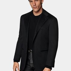 This black blazer is cut to a relaxed fit, providing a roomy chest and shoulders with natural shoulders. It features a single-breasted closure, wide notch lapels, and jetted pockets. Timeless Black Long Sleeve Blazer, Black Single-breasted Professional Blazer, Black Blazer With Concealed Placket, Professional Black Outerwear With Suit Collar, Black Sport Coat With Lapel Collar For Office, Luxury Black Blazer With Lapel Collar, Timeless Black Blazer With Lapel Collar, Black Long Sleeve Blazer With Concealed Placket, Tuxedo Style Outerwear With Lapel Collar And Welt Pockets