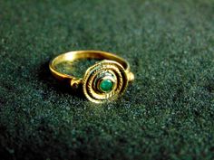 Beautiful women's gemstone ring. It is made completely out of 14k gold (aka gold 585 each piece is stamped), with a stunning emerald in its center... 14k Gold Byzantine Style Rings, Traditional Yellow Gold Emerald Ring, Traditional Yellow Gold Round Emerald Ring, 14k Gold Byzantine Round Ring, 14k Gold Byzantine Style Round Rings, Green Byzantine Style Round Jewelry, Byzantine Style Yellow Gold Ring, Byzantine Yellow Gold Ring, Yellow Gold Byzantine Style Ring