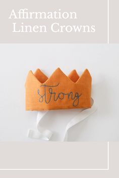 an orange crown with the words,'affirmation linen crowns'written on it