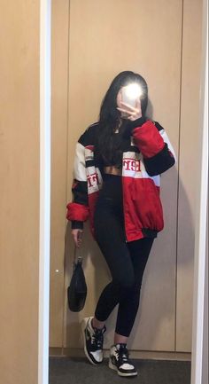 girl with dark long hair wearing black leggings, black top, ferrari racer jacket, black shoulder bag and jordan’s in a mirror pic F1 Racer Jacket, F1 Race Day Outfits, Racing Style Outfits, F1 Inspired Outfits, Ferrari Jacket Aesthetic, Race Track Outfit Women, Car Racer Outfit, Race Car Outfits For Women