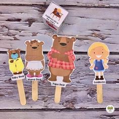 there are three bears on toothpicks with labels