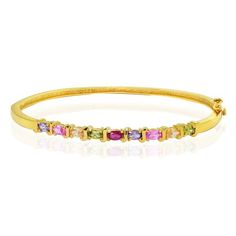 This bangle features prong set multi-colored various stones intermediated by S designs. It showcases 2 created pink sapphire stones, 2 simulated amethyst stones, 2 green CZs, 2 champagne CZs, and one red amber CZ stone. The bracelet is crafted of gold over sterling silver. Wear this chic bracelet solo, or pair it with other bangles for a dramatic effect. Color: Metal Type. Gender: female. Age Group: adult. Multicolor Stone Bangle Crystal Bracelet, Multicolor Gold Bracelet With Gemstones, Elegant Pink Multi-stone Bracelets, Adjustable Multicolor Gemstone Bangle, Pink Gemstone Bangle Jewelry, Multicolor Gemstone Accented Bangle Bracelet, Multicolor Stone Bangle Bracelet, Sapphire Stones, Amethyst Stones