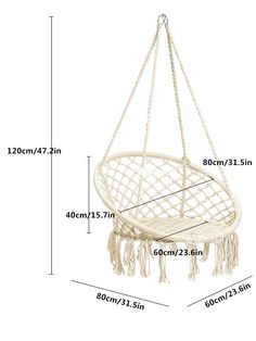 a white hanging hammock with tassels measurements