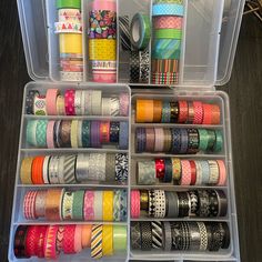 a plastic container filled with lots of different types of washi tapes