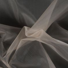 If you need to add volume to any application, try this Stiff Polyester Organdy! The low opacity and medium weight make it perfect for underlays. Its stiff drape allows it to be easily sculpted for any type of structured look. A bit rough in texture, this fabric may require a lining. Use this fabric to make fuller dresses and skirts. To decipher the differences in use between organza and organdy fabrics, take note that organdy is much stiffer than an organza, thus allowing for more structural out Organdy Fabric, Full Dress, Organza Fabric, Light Peach, Fantasy Dress, Fabric Texture, The Low, Medium Weight, Make It