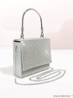 BagForLove - Party-ready Mini Square Bag with Glitter Flap and Rhinestone Detail Product Description Color Silver Details Rhinestone Magnetic Yes Strap Type Top Handle Bag Size Mini Pattern Type Plain Type Square Bag Closure Type Flap Material Glitter Composition 100% Polyester Size Chart INCH CM Bag Height Bag Length Bag Width Handle Height Strap Length 5.5 inch 6.3 inch 2.8 inch 4.3 inch 47.2 inch Bag Height Bag Length Bag Width Handle Height Strap Length 14 cm 16 cm 7 cm 11 cm 120 cm Details Pictures Similar Products h2 { text-align: center; } /* æ¢è¡ */ li{ white-space: normal; word-break: break-all; word-wrap: break-word; } .red-box { width: 100%; display: flex; flex-direction: row; flex-wrap: wrap; justify-content: center; } .red-box > div { width: 190px; height: 250px; margin: 10p Rhinestone Handheld Evening Bag For Party, Handheld Rhinestone Evening Bag For Party, Glamorous Evening Bag With Rhinestones For Party, Glamorous Rhinestone Bags For Prom, Party Shoulder Bag With Rhinestones, Rectangular, Rhinestone Clutch Shoulder Bag For Party, Silver Shoulder Bag With Rhinestones For Party, Glamorous Glitter Bag For Evening, Evening Glitter Shoulder Bag