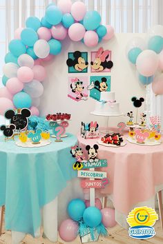 a birthday party with balloons and mickey mouse decorations