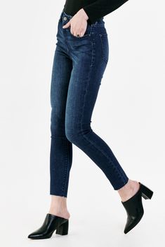 Super high rise ankle skinny jeans. It's the flirty fit that sits at the natural waist and fitted skinny in the hips through the leg. Ankle inseam on comfort stretch denim accented with back "X" belt loop, handsanding hip whiskers, tonal navy stitching, cut-off hem details.10 1/2" Front Rise (include waistband), 10" Leg Opening, 28" inseam (Size 27) 92% COTTON 6% RECYCLED POLYESTER 2% SPANDEX Machine wash cold, Tumble dry low Imported Zip fly and button closure Five-pocket style Dark Wash High Rise Jeans With Frayed Hem, Dark Wash Stretch Cropped Jeans With Frayed Hem, High Waist Medium Wash Jeggings With Five Pockets, Stretch Cropped Jeans With Frayed Hem In Dark Wash, High Rise Stretch Bottoms With Frayed Hem, Fall Mid-rise Jeans With Frayed Hem, Tight Spring Denim Jeans, High Rise Dark Wash Pants With Frayed Hem, High-rise Stretch Bottoms With Frayed Hem