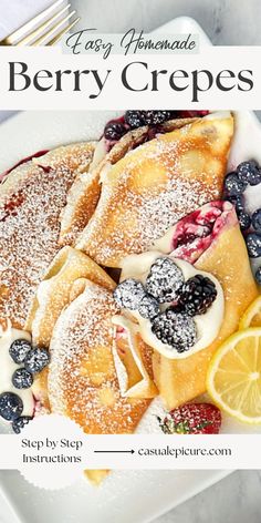 berry crepes with powdered sugar and blueberries on a white platter