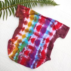 Get Your Hippie On! This Is An Adorable Hand Tie Dyed Onesie In 100% Cotton. Rabbit Skins Brand, Size 6 Months. I Used High Quality High Pigment Dyes. Comes New With Artisan Tag (Garment Washed During Tie Dye Process.) 100% Designed & Handmade In My Studio Artisan Made Wearable Art Handmade Bohemian Bohochic Bohostyle Boho Gypsy Baby Gap Carters Baby Toddler Anthropologie Old Navy Bohobaby Sleepsack Pant Suit One Piece Onesie Pajamas Pjs Tiedye Dip Dye Space Dye Ice Dye Kettle Dyed Playful Multicolor Bodysuit For Playtime, Red Cotton Short Sleeve Bodysuit, Red Short Sleeve Cotton Bodysuit, Multicolor Cotton Playtime Bodysuit, Multicolor Cotton Bodysuit For Playtime, Cute Multicolor Playtime Bodysuit, Fitted Multicolor Bodysuit For Playwear, Casual Red Cotton Bodysuit, Playful Multicolor Cotton Bodysuit