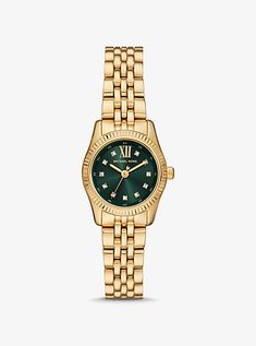 The Lexington watch exudes everyday glamour with its gold hue and sparkling pavé accents at the hour markers. Made entirely of stainless steel, this mini timepiece boasts an emerald-green face with a beveled topring and a matching bracelet strap. Slip it on to give both day and night outfits a dose of sophisticated charm. Women’s Watch, Womens Gold Watch, Watches Women Michael Kors, Gold Watches Women, Jewelry Lookbook, Matching Bracelet, Classic Chic, Michael Kors Accessories, Matching Bracelets