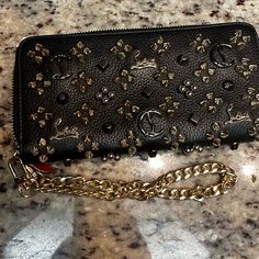 Gorgeous Wallet. Has Silver,Gold, And Gunmetal!!! Excellent Condition. Only Some Coin Residue. I Will Include A Wrist Chain To Use As A Wristlet. Elegant Black Wallet, Designer Black Wallet With Gold-tone Hardware, Designer Gold Wallet With Chain Strap, Black Luxury Wallet With Branded Hardware, Designer Black Wallets With Gold-tone Hardware, Luxury Leather Wallets With Branded Hardware, Luxury Black Wallets With Gold-tone Hardware, Luxury Evening Wallets With Branded Hardware, Luxury Black Clutch With Palladium Hardware