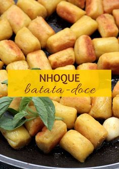 some food is cooking in a skillet on the stove with a yellow sign that says nique batata - doce