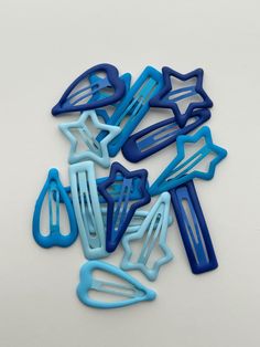 This stunning set of 15 matte blue hair clips features five unique shapes, including stars, hearts, and classic barrettes, allowing you to express your style effortlessly. The rich blue hues, ranging from deep navy to soft powder blue, provide a chic and modern aesthetic that pairs beautifully with any outfit. Each clip is designed with a smooth matte finish for a contemporary look, ensuring a secure hold for all hair types. Perfect for everyday wear, special occasions, or adding a pop of color to your hairstyle. Blue Hair Clips, Blue Hair Clip, Unique Shapes, Christmas Deals, Modern Aesthetic, Hair Barrettes, Powder Blue, Blue Hues, Hair Types