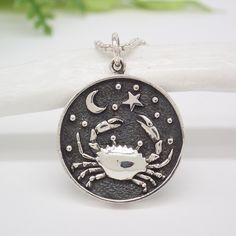 Sterling Silver Astrology Cancer Pendant Sterling Silver Engraved Spiritual Charms, Silver Zodiac Sign Medallion Jewelry, Silver Symbolic Round Pendant Charms, Symbolic Silver Round Pendant Charms, Symbolic Sterling Silver Moon Phase Jewelry, Symbolic Moon Phase Sterling Silver Jewelry, Engraved Sterling Silver Symbolic Charms, Sterling Silver Zodiac Sign Medallion Jewelry, Sterling Silver Zodiac Pendant Jewelry