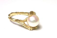 Beautiful 14k Yellow Gold Pearl Ring Price ReducedSize 5.53.7 GramsFEEL FREE TO MESSAGE ME WITH A BEST OFFER!121112-947Please contact me if you are interested in purchasing multiple items, I am happy to negotiate and accommodate any request!_________________________________________________________________________* Back to Shop Watch and Wares? https://www.etsy.com/shop/watchandwares* Ready to purchase? Click the green button "Add to cart" * Have a question? Click the button "Ask a question" * Wa Unique Yellow Gold Pearl Ring For Anniversary, Unique Yellow Gold Pearl Ring For Wedding, Unique 14k Yellow Gold Pearl Ring, Unique Gold Pearl Ring For Formal Occasions, Handmade Gold Pearl Ring For Formal Occasions, Gold Pearl Ring, Bamboo Design, Green Button, Gold Pearl