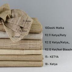 a stack of folded linens with the names of each item on them and labeled in different languages