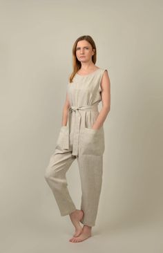 "Sleeveless loose fit linen jumpsuit. Pockets on the front. Zipper in the back. *This garment is true to size, and we recommend choosing the size you usually wear. If you want the garment to be loose-fitting, choose a larger size than you usually wear. Details * weight: 205 g/m² or 6.05 oz/yd² * 100% natural Baltic linen * softened * breathable, anti-allergic * light, very durable and strong * easy to wash * suitable for children Model wears size S, 172 cm/5'7\" tall. GARMENTS ARE DESIGNED FOR 164-176 CM HEIGHT ( 5'5\"-5'9\") PLEASE LEAVE A NOTE WITH YOUR ORDER, IF YOUR HEIGHT DOES NOT FALL IN THIS RANGE. SIZE GUIDE Body measurements: in cm/inch: XXS/34 bust: 79-82 cm (31\"-32\") waist: 62-64 cm (24\"-25\") hips: 84-86 cm (33\"-34\") XS/36 bust: 84-88 cm (33\"-34\") waist: 64-68 cm (25\"-2 Red Ruffle Dress, Womens Jumpsuits, Blue Jumpsuit, Red Dress Women, Linen Shirt Dress, Jumpsuit Summer, Linen Jumpsuit, Blue Jumpsuits, Summer Linen