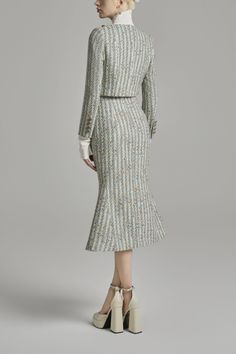 Crafted with exquisite tweed fabric and adorned with luxurious button details, this jacket exudes elegance and sophistication. Its cropped design offers a modern twist, perfect for the fashion-forward woman. Elevate your wardrobe with this premium piece and make a statement wherever you go. Tweed Midi Skirt, Trumpet Silhouette, Mean Blvd, Tweed Skirt, Chanel Paris, Tweed Fabric, Feminine Look, Skirt Design, Tweed Jacket