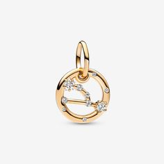 Let the stars guide your look with the Taurus Zodiac Dangle Charm. The dangle is crafted our 14k gold-plated unique metal blend, has a circular outer frame and features clear sparkling cubic zirconia as well as the shape of the Taurus zodiac sign. The back side of the frame is engraved with "Taurus".Loyal, trustworthy and strong-minded, the Taurus in your life can always be counted on to be good-natured, down-to-earth and tenacious. Wear this Pandora Moments Dangle Charm as a sign of your own sign's strength or give it as a gift of appreciation to the Taurus in your life. - Pandora Taurus Zodiac Dangle Charm - 14k Gold-plated unique metal blend / Cubic Zirconia / Clear Pandora Charm, Mesh Bracelet, Taurus Zodiac, Dangle Charms, Bracelets And Charms, Snake Chain, Pandora Charms, Chain Bracelet, Leather Bracelet