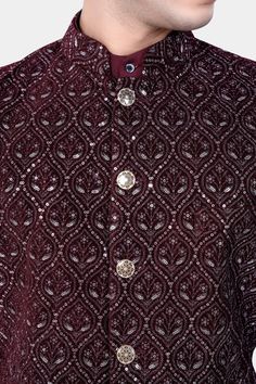 Elevate your ensemble with our Aubergine Maroon Nehru Jacket adorned with exquisite sequins and thread embroidery, perfect for weddings, engagements, or parties. This versatile piece seamlessly transitions from formal to casual wear, adding a touch of sophistication to any outfit. Pair it effortlessly with a kurta jacket set for a complete look. Embrace timeless elegance and make a statement with this meticulously crafted Nehru jacket designed for men of discerning taste. In addition to being co Festive Semi-stitched Embellished Sherwani, Festive Embellished Semi-stitched Sherwani, Nehru Jacket With Intricate Embroidery For Eid Party, Traditional Embellished Sherwani For Festive Occasions, Eid Party Nehru Jacket With Intricate Embroidery, Traditional Embellished Bandhgala For Festive Season, Festive Bandhgala With Intricate Embroidery For Eid, Eid Festive Bandhgala With Intricate Embroidery, Festive Eid Bandhgala With Intricate Embroidery