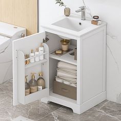 a white bathroom sink sitting next to a toilet