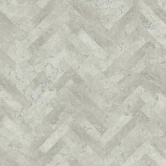 a white and grey tile wallpaper with an irregular pattern on it's surface