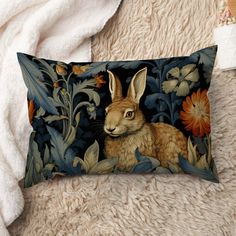 a decorative pillow with an image of a rabbit on it