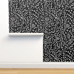 an abstract black and white painting on the wall