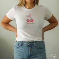 Cherries on Top Coquette Shirt Cute Cherries on Top tee to fit the coquette aesthetic This shirt does run small. It is a women's form fitting, light-weight tee. SHIRT DETAILS - Bella + Canvas 6004, Women's Slim Fit Tee - 100% airlume combed and ringspun cotton (fiber content may vary for different colors) - Light fabric - Slim fit - Runs smaller than usual - Colors may vary slightly due to different monitors and devices CARE INSTRUCTIONS - Machine wash: turn inside-out, use warm/cold water, wash with like colors - Tumble dry: low heat - Do not bleach - Do not iron directly on the design - Do not dry clean PROCESSING TIME - Processing: 1 - 5 days - U.S. Standard Shipping: 2 - 5 days - Your order should arrive between 3 - 10 days, varying on location and holiday seasons ADDITIONAL INFO - Des Clothing Preppy, Coquette Clothing, Coquette Shirt, Preppy Shirt, Shirt Coquette, Soft Girl Aesthetic, Aesthetic Y2k, Cherry On Top, Trendy Tee