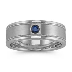 a white gold ring with blue sapphire in the center