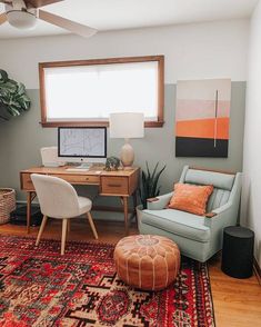 a living room filled with furniture and a rug